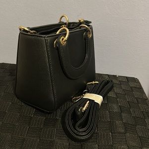 Windsor mini black bag with cross body strap. Never used.